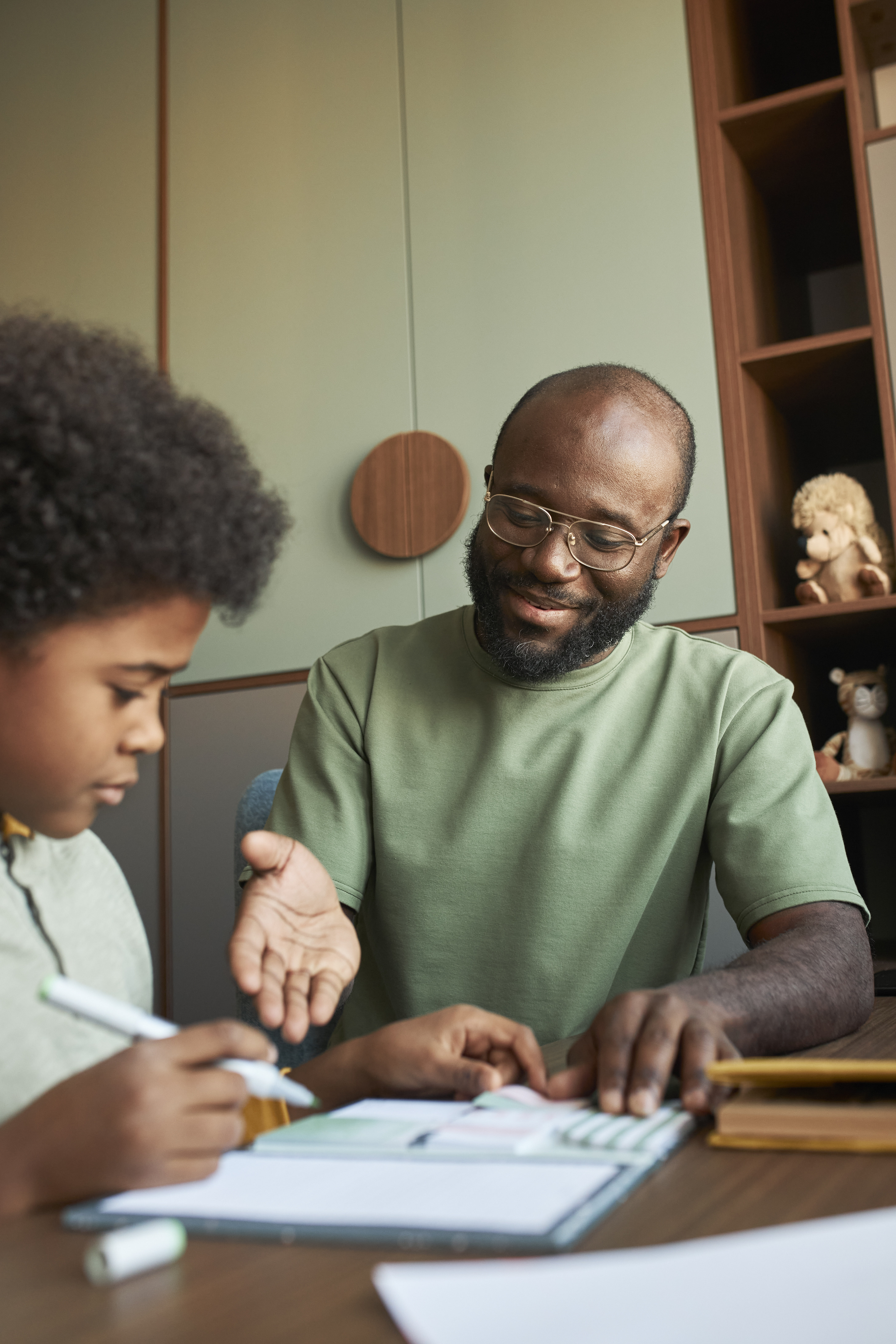 Child doing homework with parent